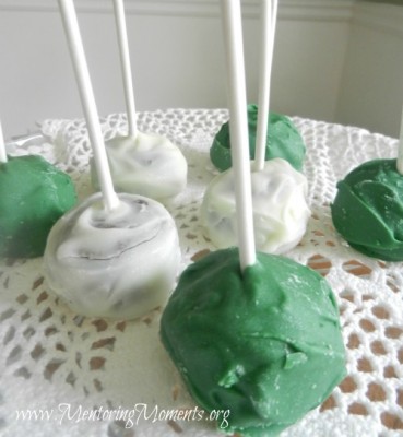 Mint Chocolate cake pops on a glass cake stand