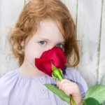 little girl with rose