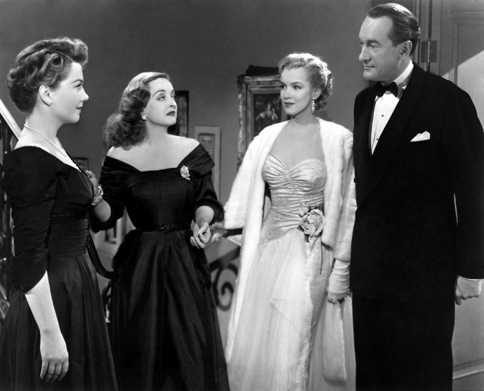 The 1950 film "All about Eve" received a record 14 Academy Award® nominations, breaking the previous record of 13 nominations held by "Gone with the Wind" since 1939. Shown here in a scene still from the film are (left to right): Anne Baxter, Bette Davis, Marilyn Monroe and George Sanders. Restored by Nick & jane for Dr. Macro's High Quality Movie Scans Website: http:www.doctormacro.com. Enjoy!
